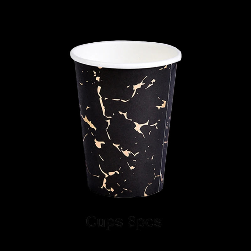 Black paper cups with gold speckles on a white background