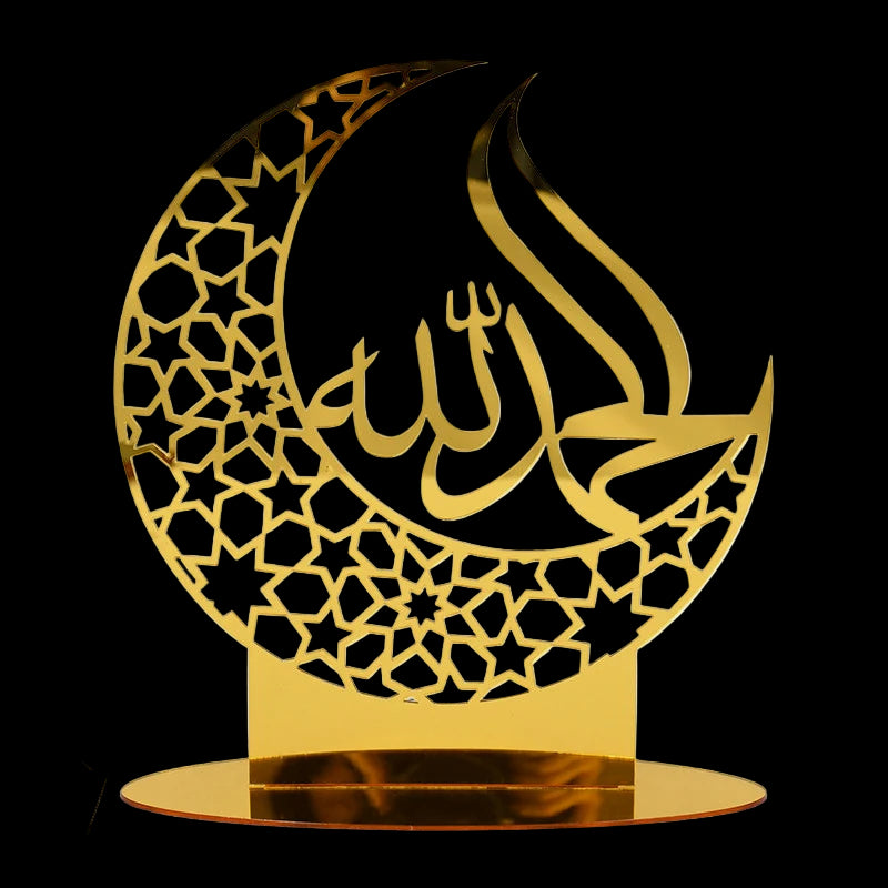 Decorative gold metal crescent moon with Arabic calligraphy on a white background