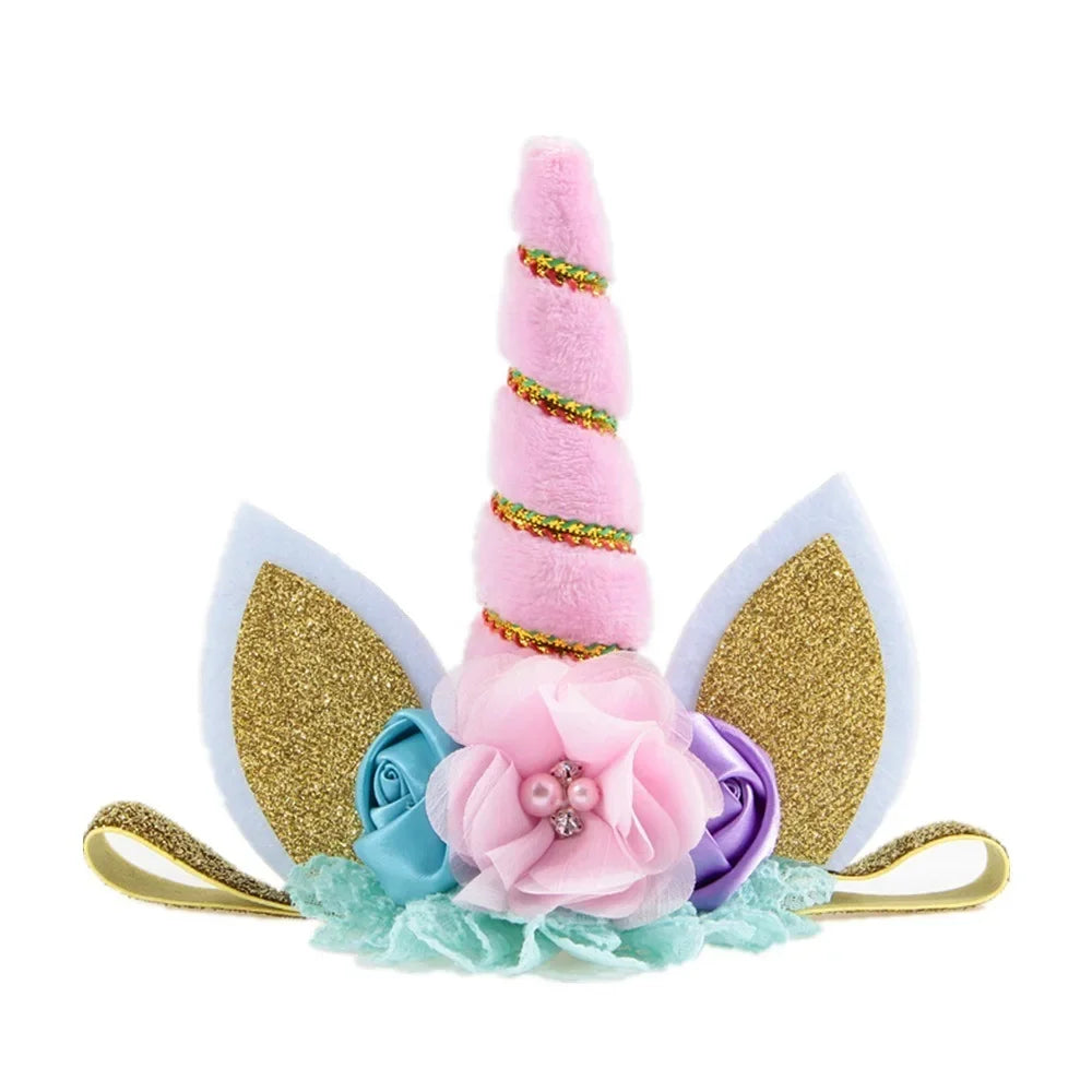 Unicorn headband with pink horn, gold ears, and flowers on a white background