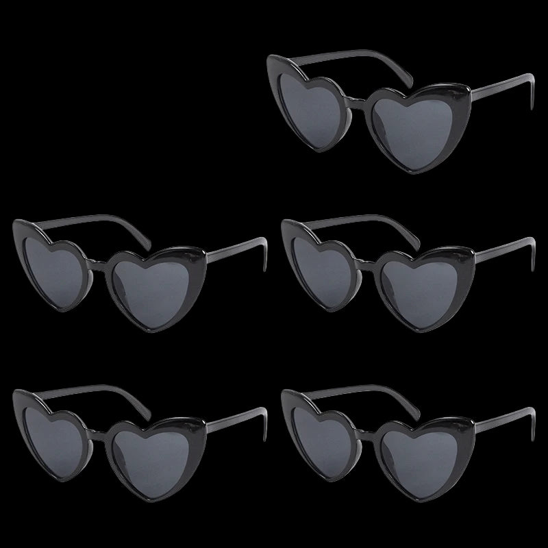 Set of five heart-shaped sunglasses with black frames and dark lenses on a white background.