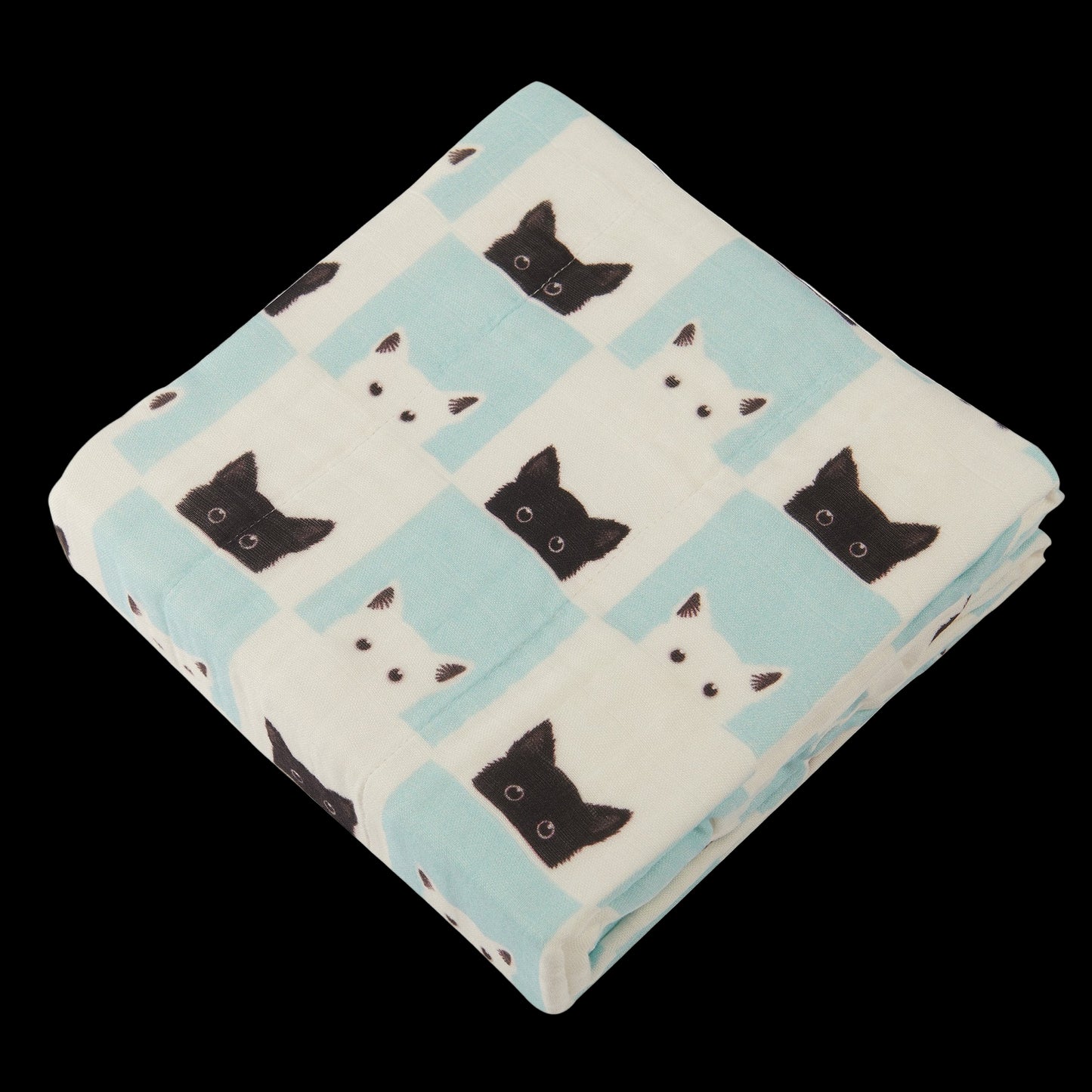Folded blanket with black and white cat pattern on a white background