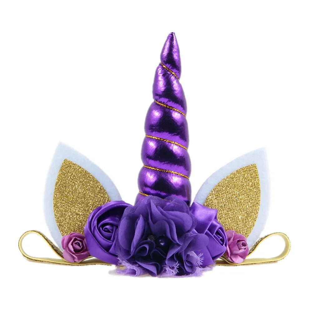 Unicorn horn headband with gold glitter ears and purple flowers on a white background
