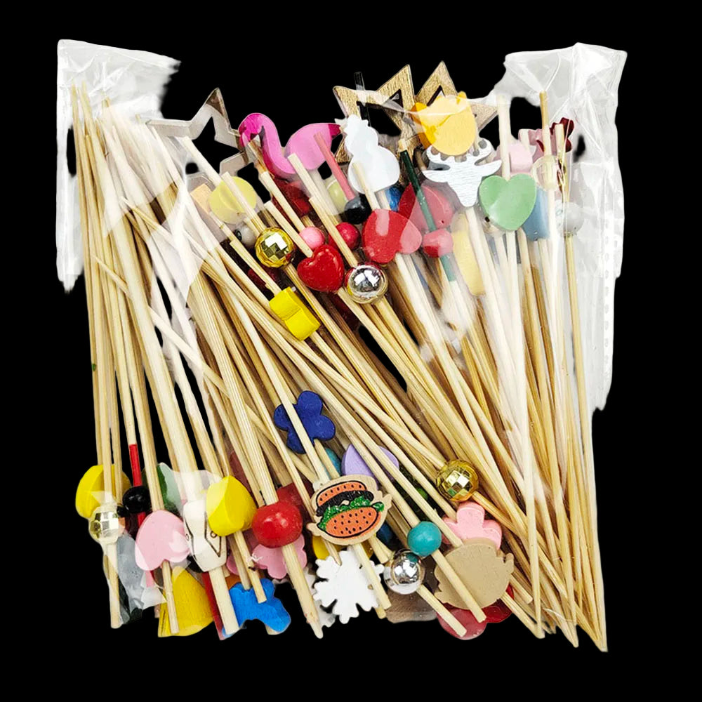 Packaged set of decorative wooden sticks with colorful embellishments on a white background
