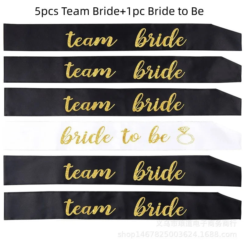 Black sashes with 'team bride' and 'bride to be' text in gold on a white background.