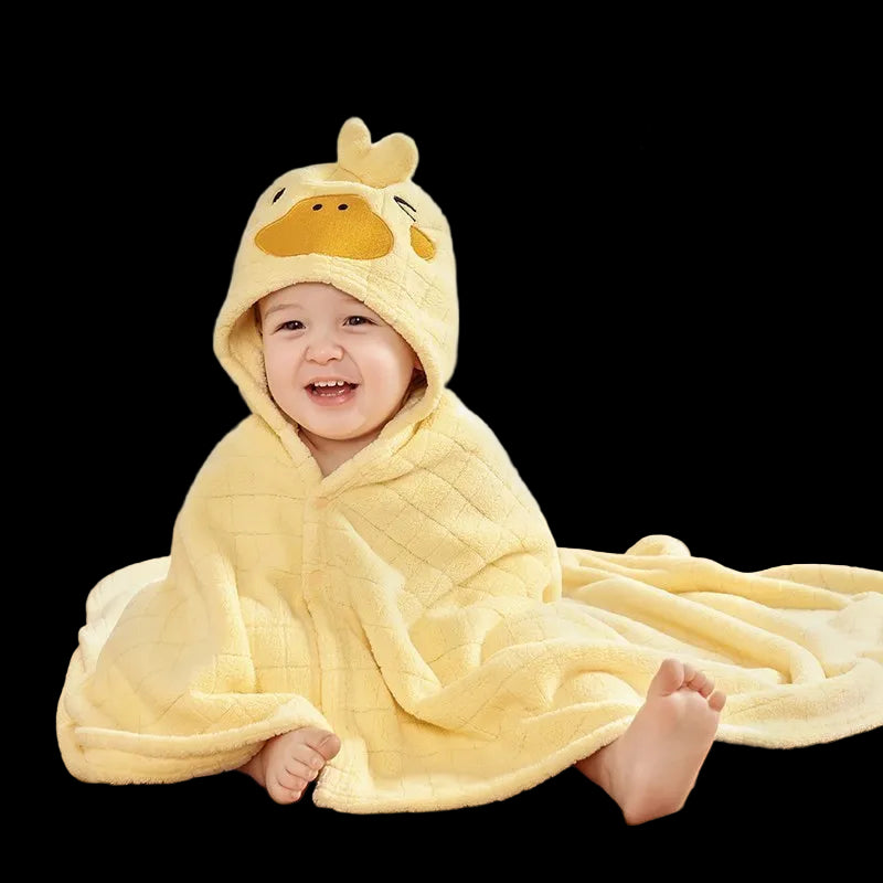 Child wearing a yellow duck-themed hooded towel with Aibedila logo.