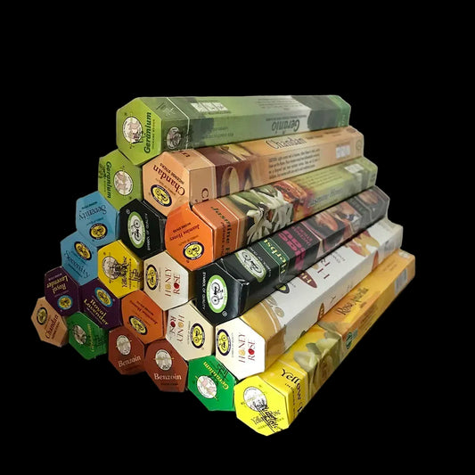 Stack of Benovon incense boxes in various colors on a wooden surface.