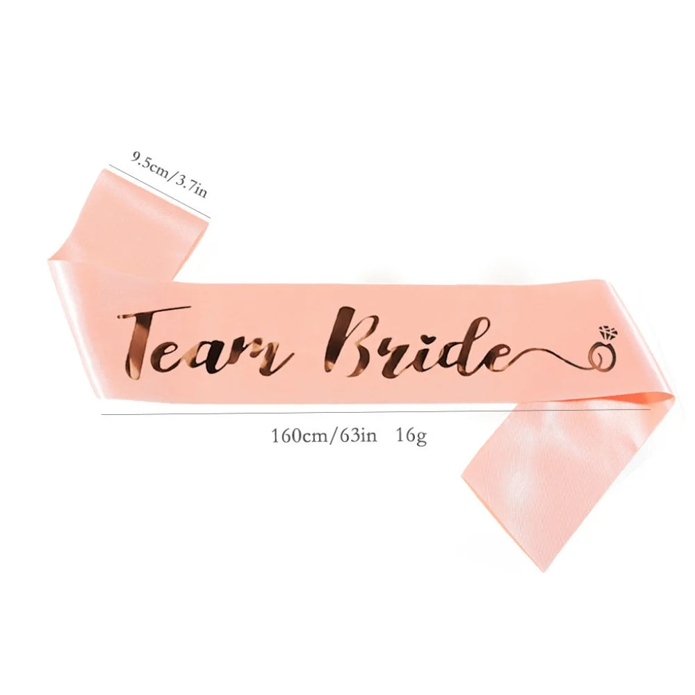 Pink 'Team Bride' sash with measurements on a white background