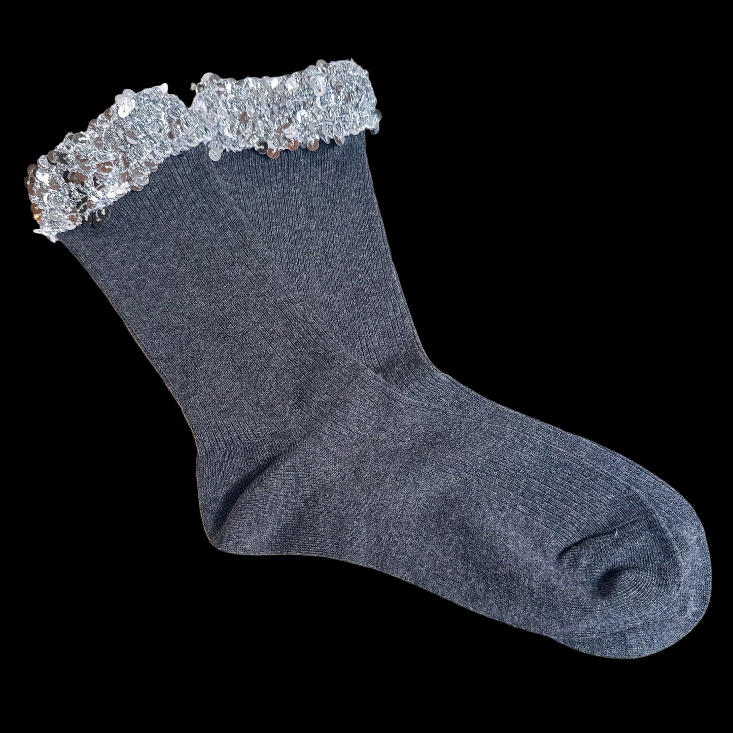 Gray sock with sequin trim on a light gray background