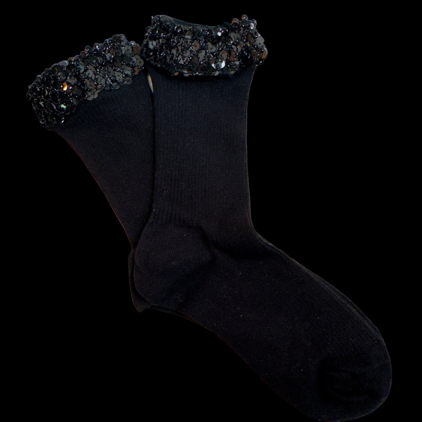 Black socks with decorative cuffs on a light background