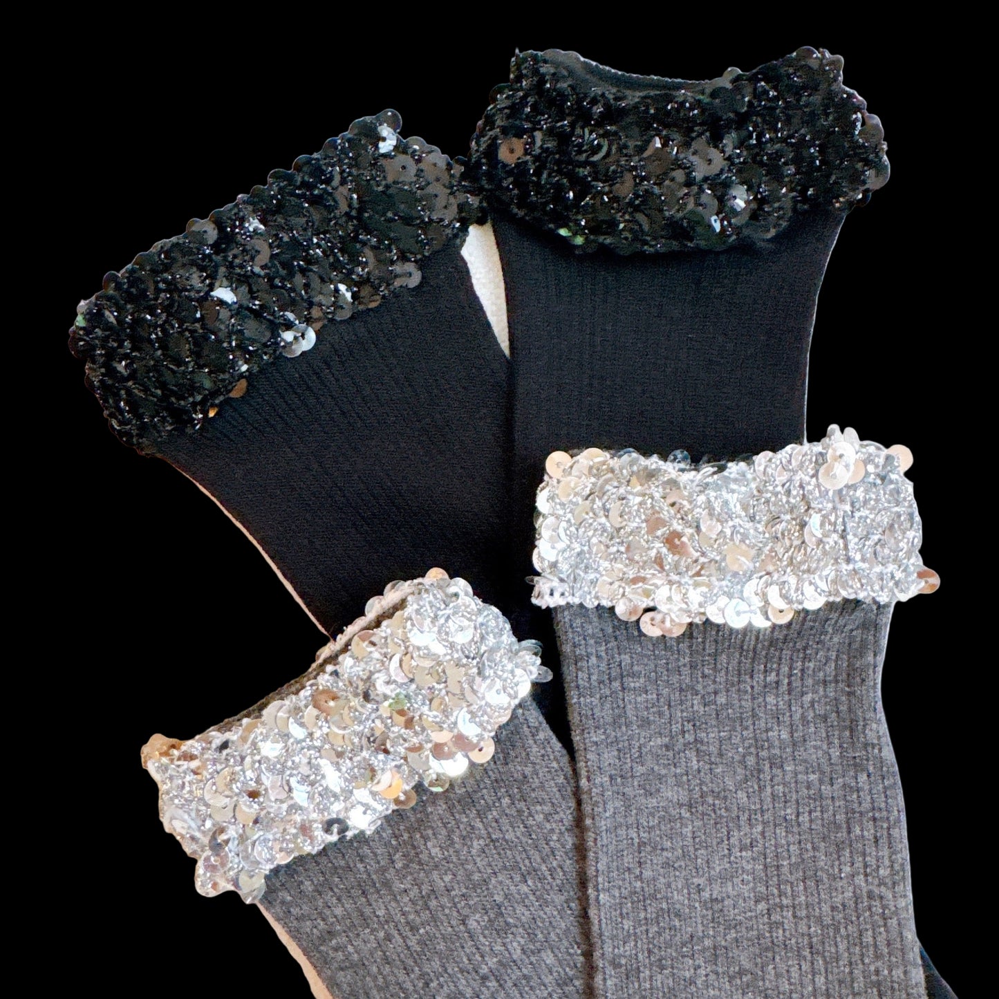 Black and gray socks with sequin trim on a light background