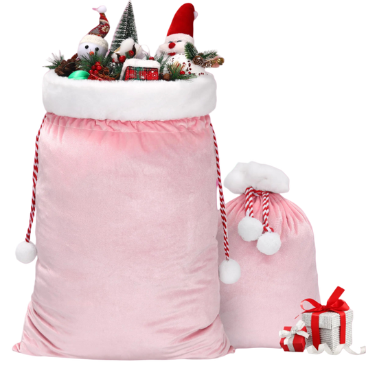 Pink Christmas sack with Santa hats and decorations on a white background