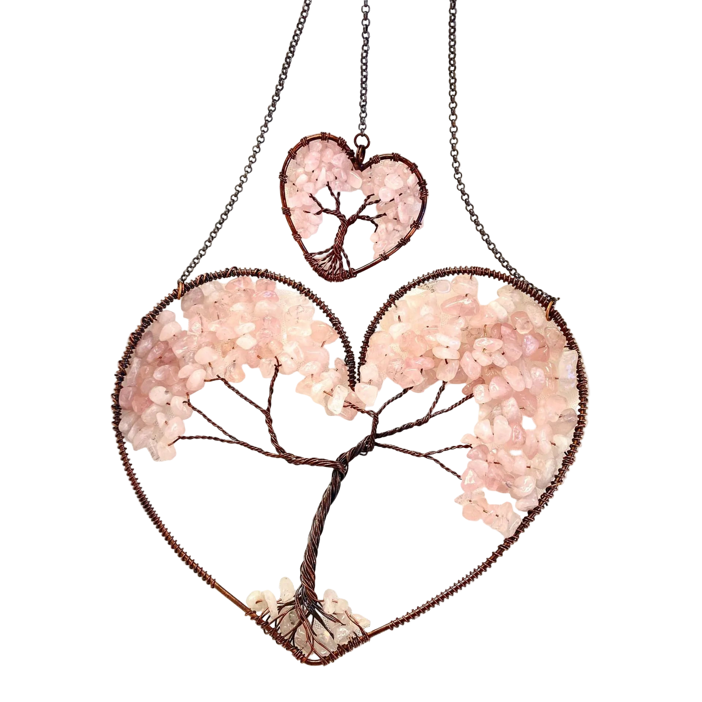 Heart-shaped jewelry with tree design on a white background