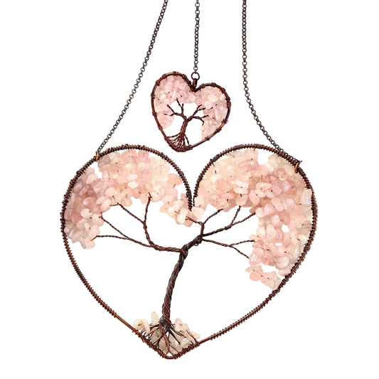 Heart-shaped jewelry with tree design on a white background