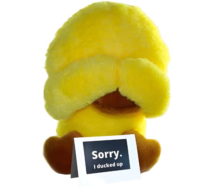 Yellow plush toy with a card saying 'Sorry. I ducked up' on a white background