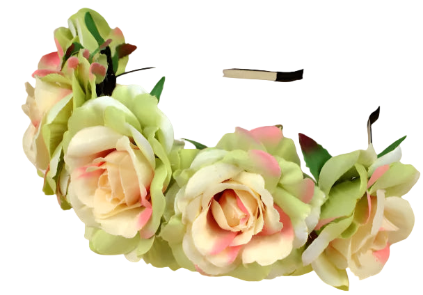 Floral headband with green and pink flowers on a wooden surface