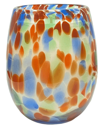 Colorful glass candle holder surrounded by white roses