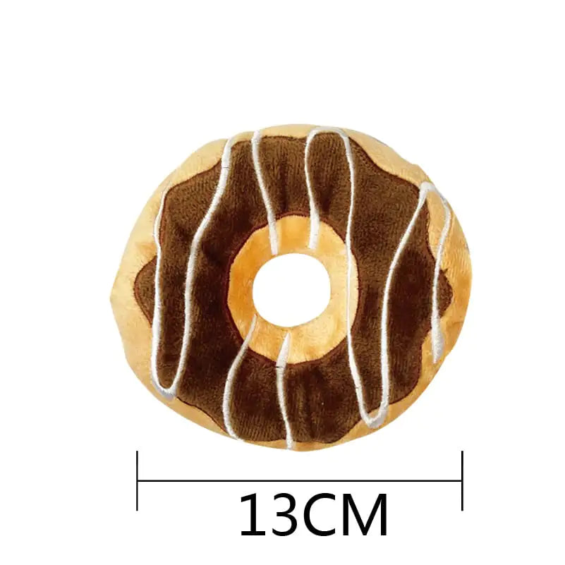 Donut-shaped plush toy with chocolate glaze and white drizzle, size indicated as 13CM.