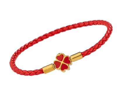 Red braided bracelet with a gold clasp featuring a red heart charm on a light beige background