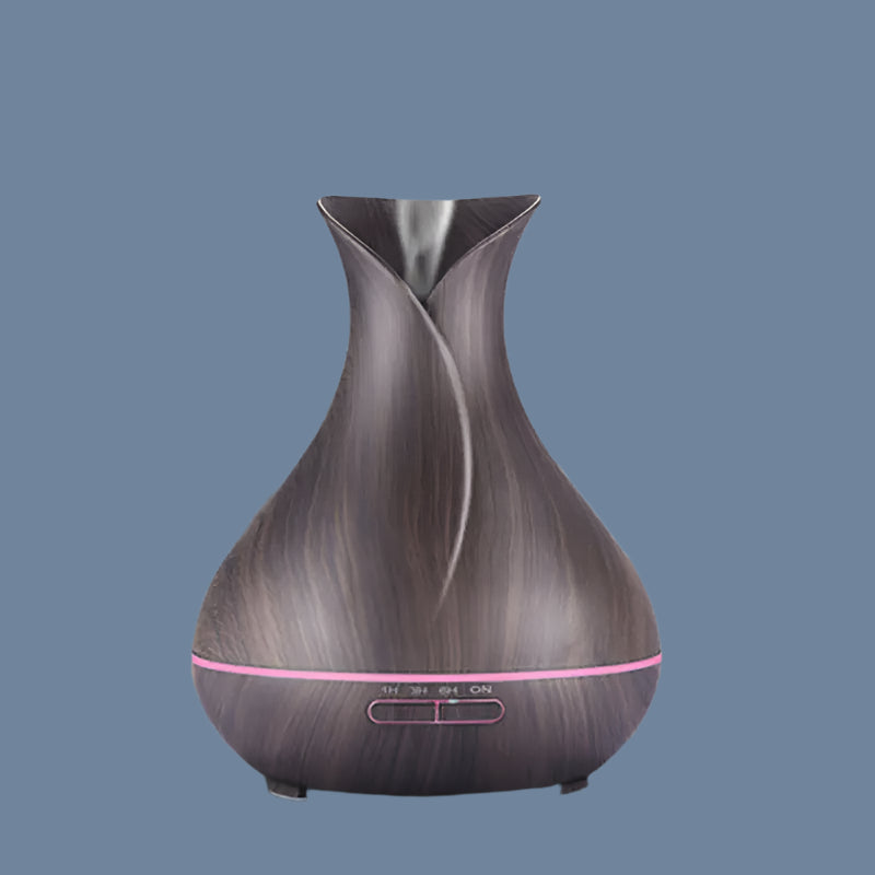 Wooden-textured diffuser on a wooden surface with a blurred background