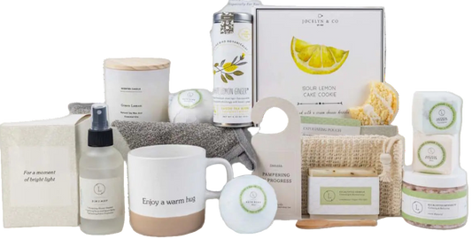 Collection of home care products including a mug, candles, and boxes on a white background