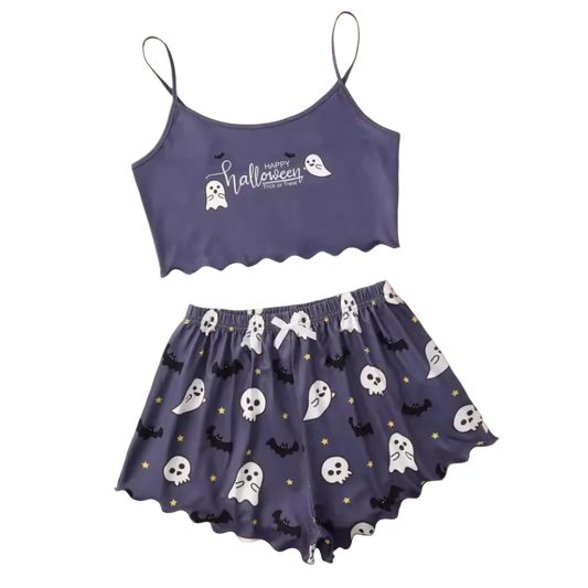 Halloween-themed purple crop top and skirt set on a white background with decorative items.