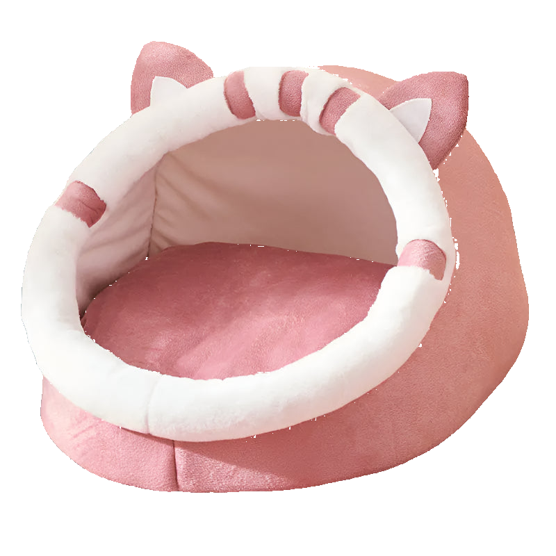Pink pet bed with cat ears on a patterned surface