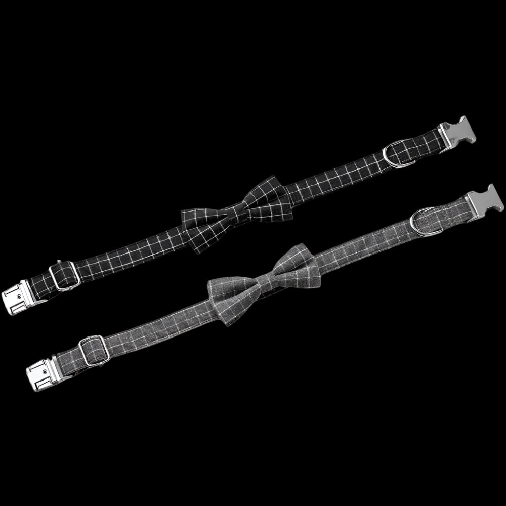 Two black checkered dog collars with bow ties on a white background