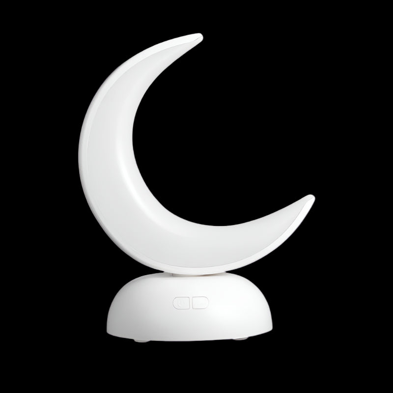 White crescent moon-shaped night light on a white background