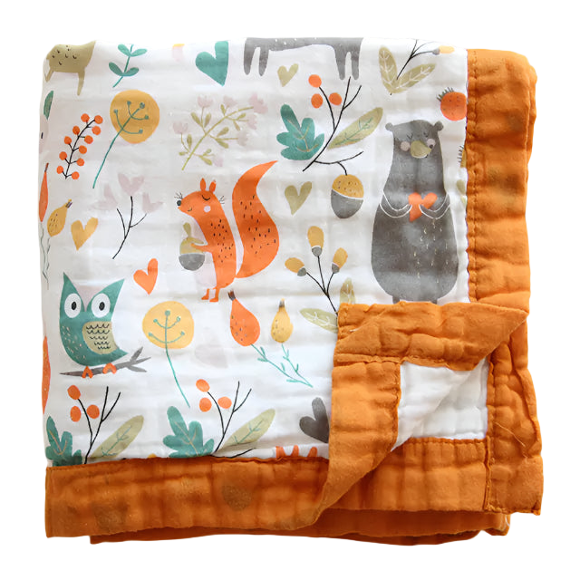 Baby blanket with animal and nature pattern on a white background