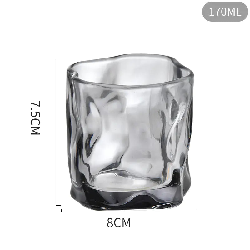 Clear glass tumbler with dimensions on a white background