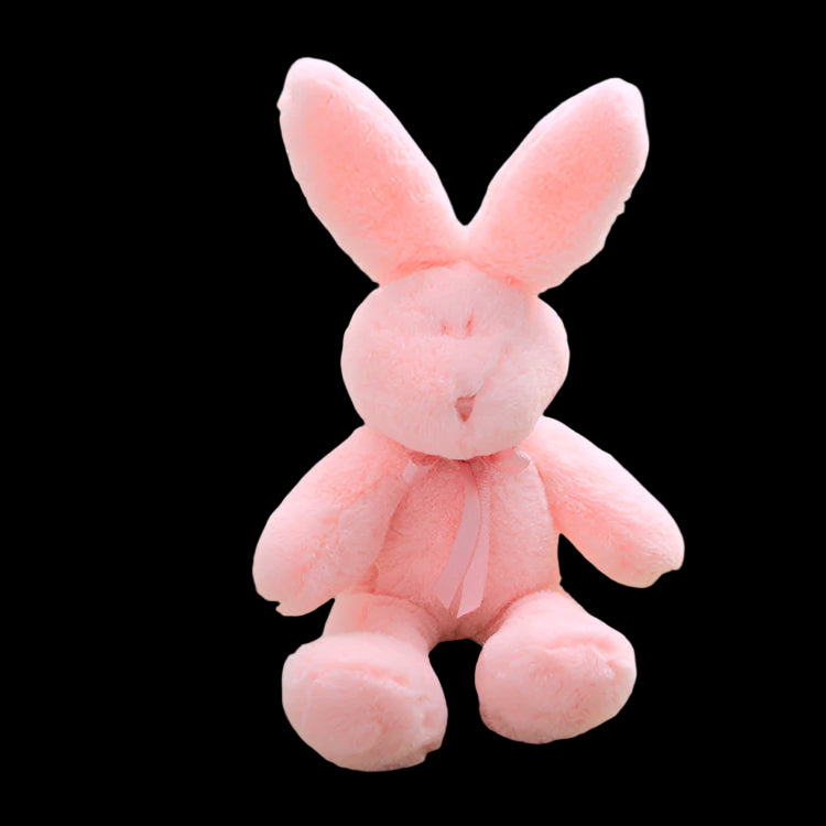 Pink plush bunny toy on a light surface