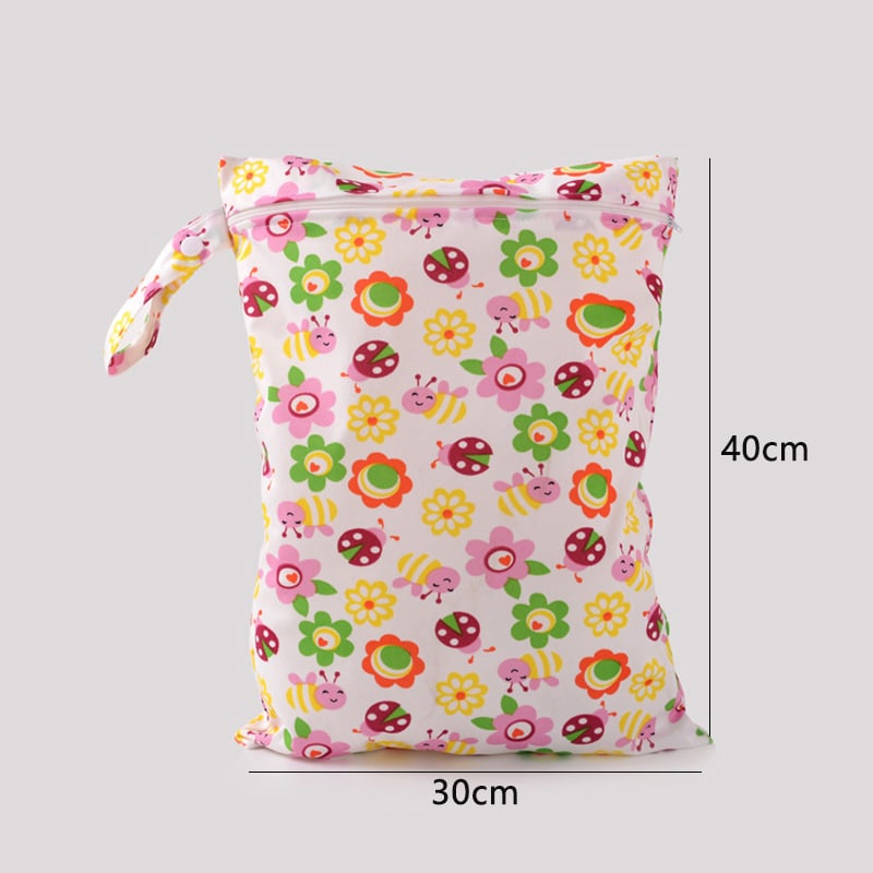 Floral and insect-patterned bag with dimensions on a gray background
