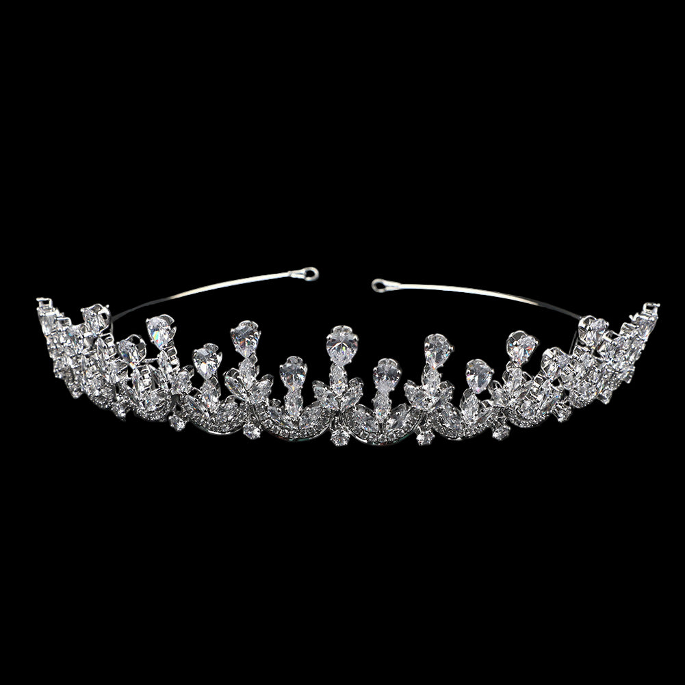 Silver tiara with clear gemstones on a black background