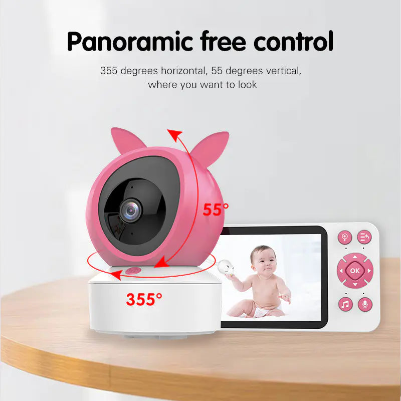 Pink baby monitor with camera and display on a wooden surface