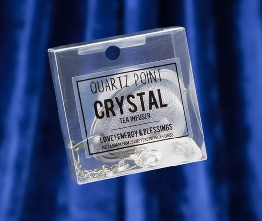 Hand holding a package of Quartz Point Crystal Tea Infuser with branding details.
