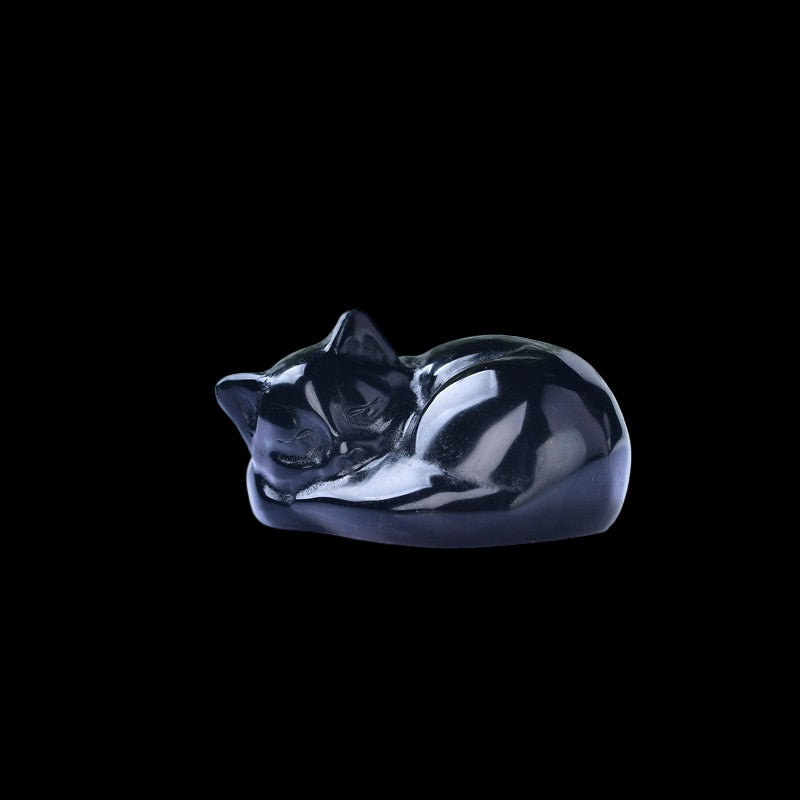 Black cat figurine on a white background