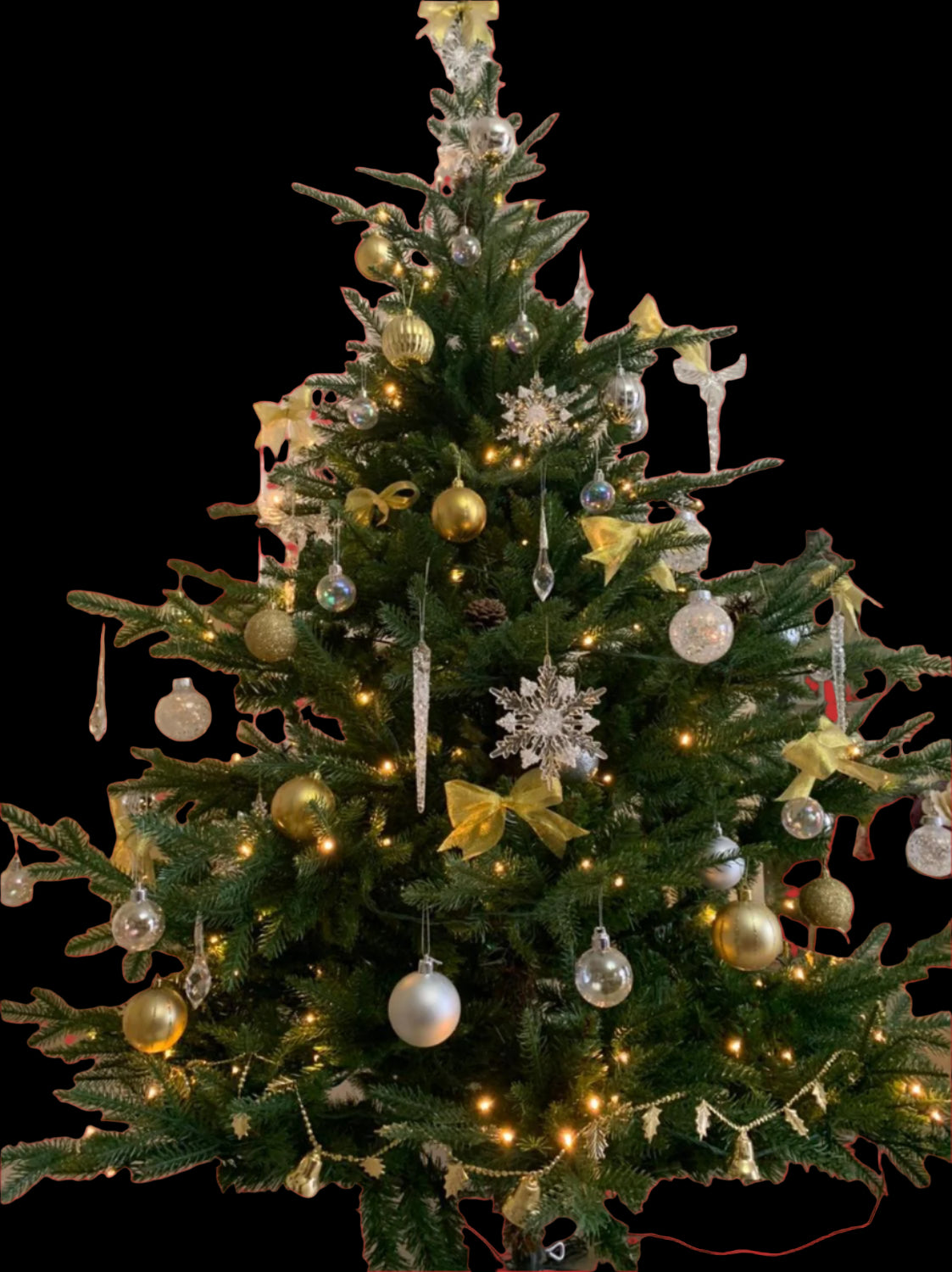 Decorated Christmas tree with ornaments and lights in a room.
