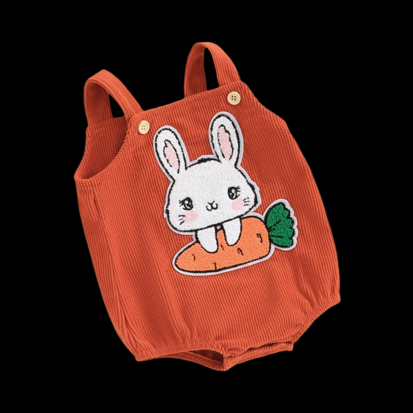 Orange baby romper with bunny and carrot design on a beige background