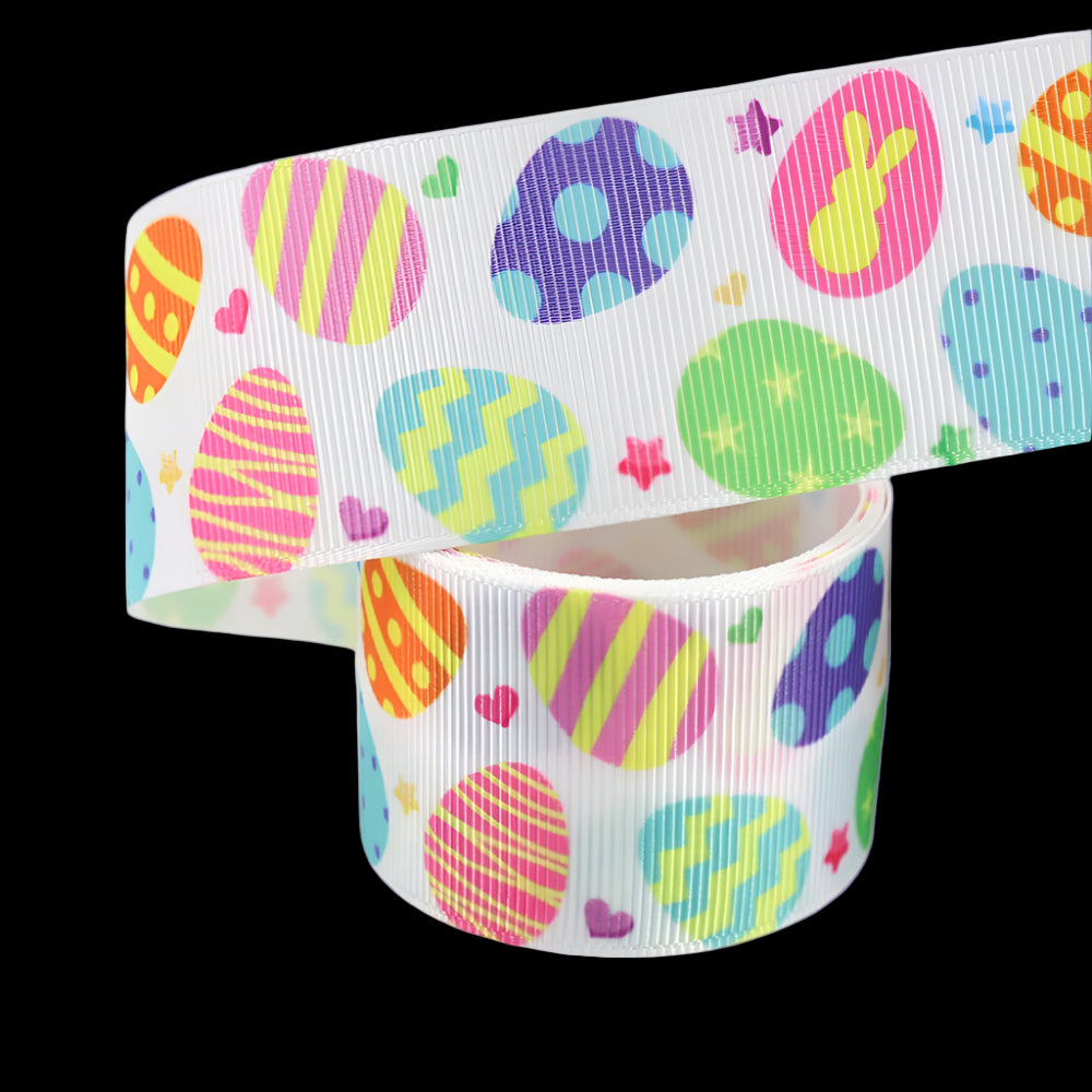 Grosgrain ribbon with colorful Easter egg pattern on a white background