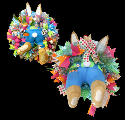 Decorative wreath with a colorful bunny design on a white background