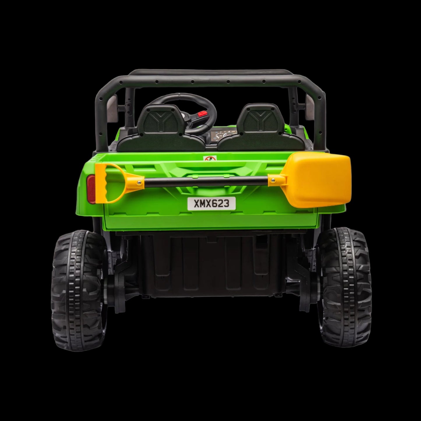 Green toy off-road vehicle with black tires and yellow shovel attachment on a white background
