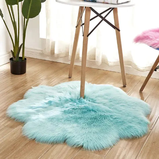 Turquoise fluffy rug on a wooden floor with a chair and plant in the background