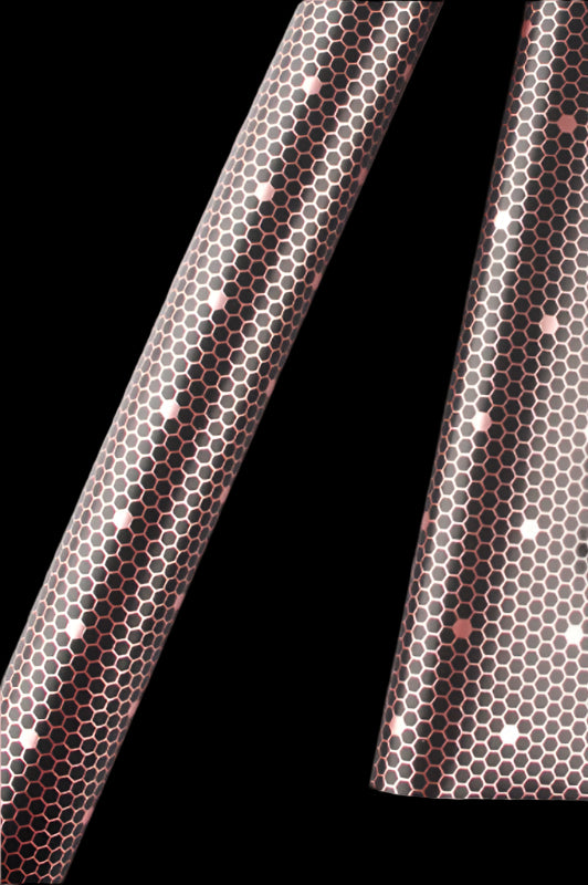 Close-up of a fabric with a hexagonal pattern on a white background