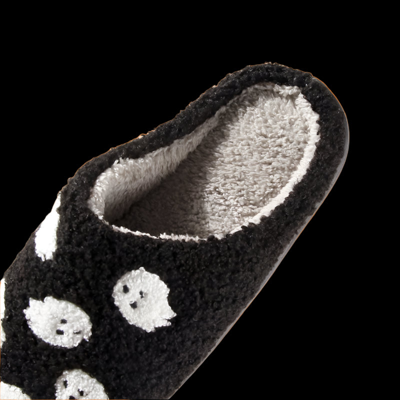 Black slipper with ghost patterns on a checkered background