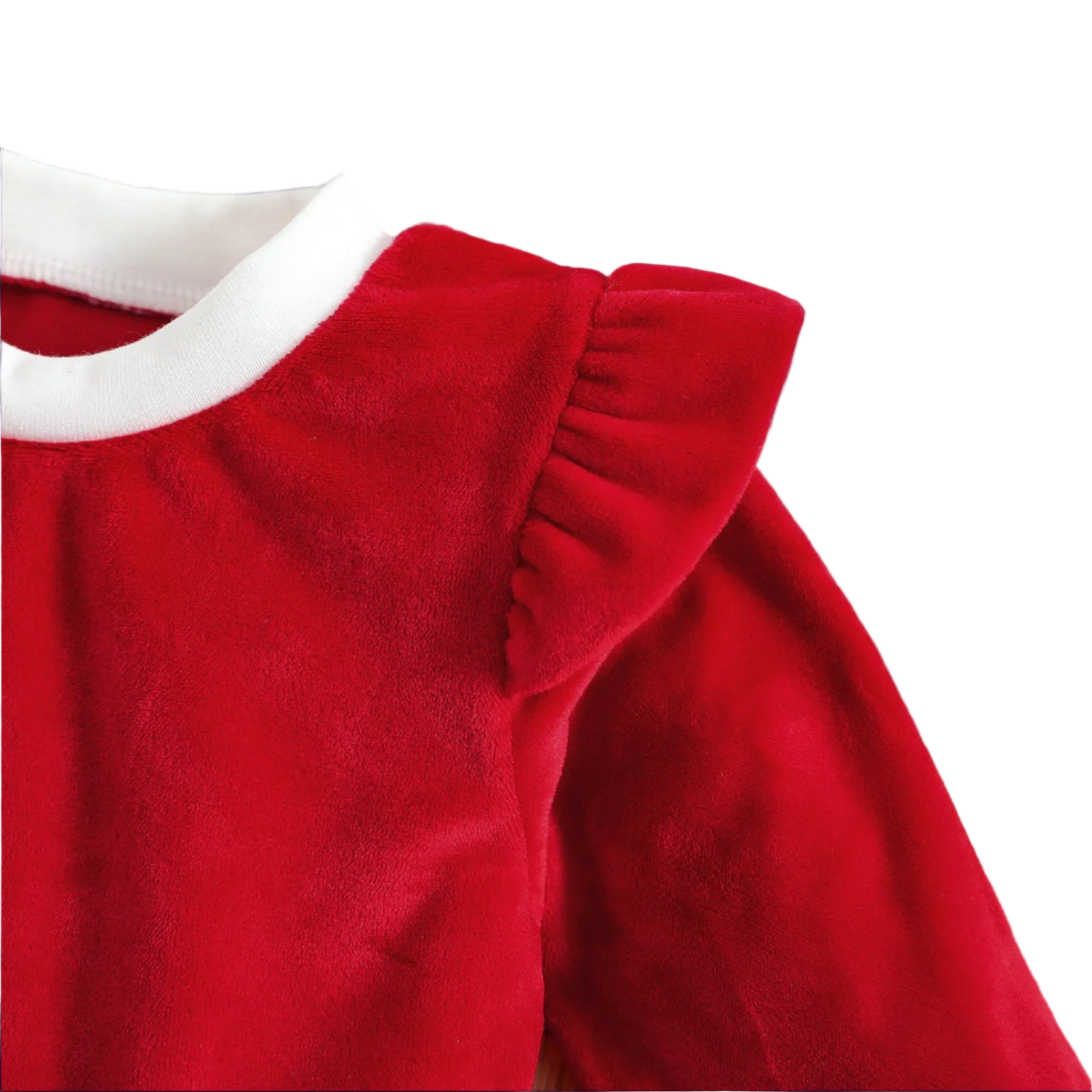 Red velvet dress with white trim on a wooden surface