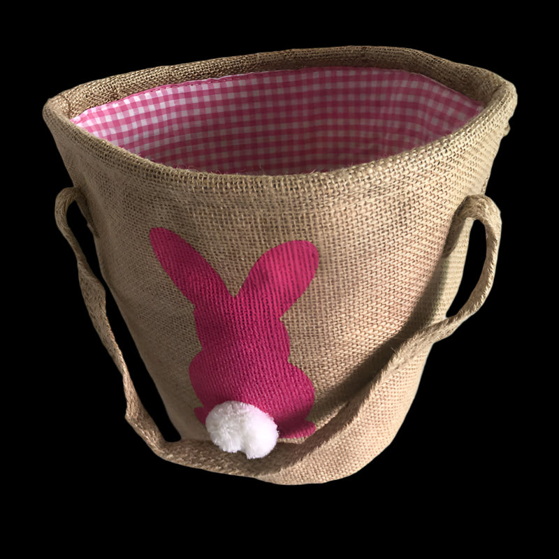 Jute basket with a pink bunny design on a white background