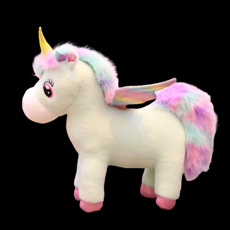 Plush unicorn toy with a colorful mane on a wooden floor.