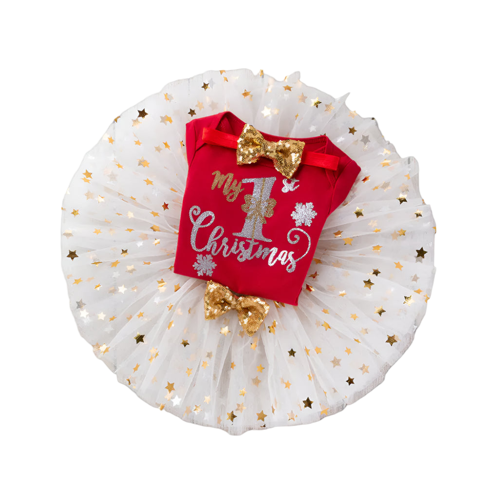 Red baby outfit with 'My 1st Christmas' text and gold bows on a wooden surface