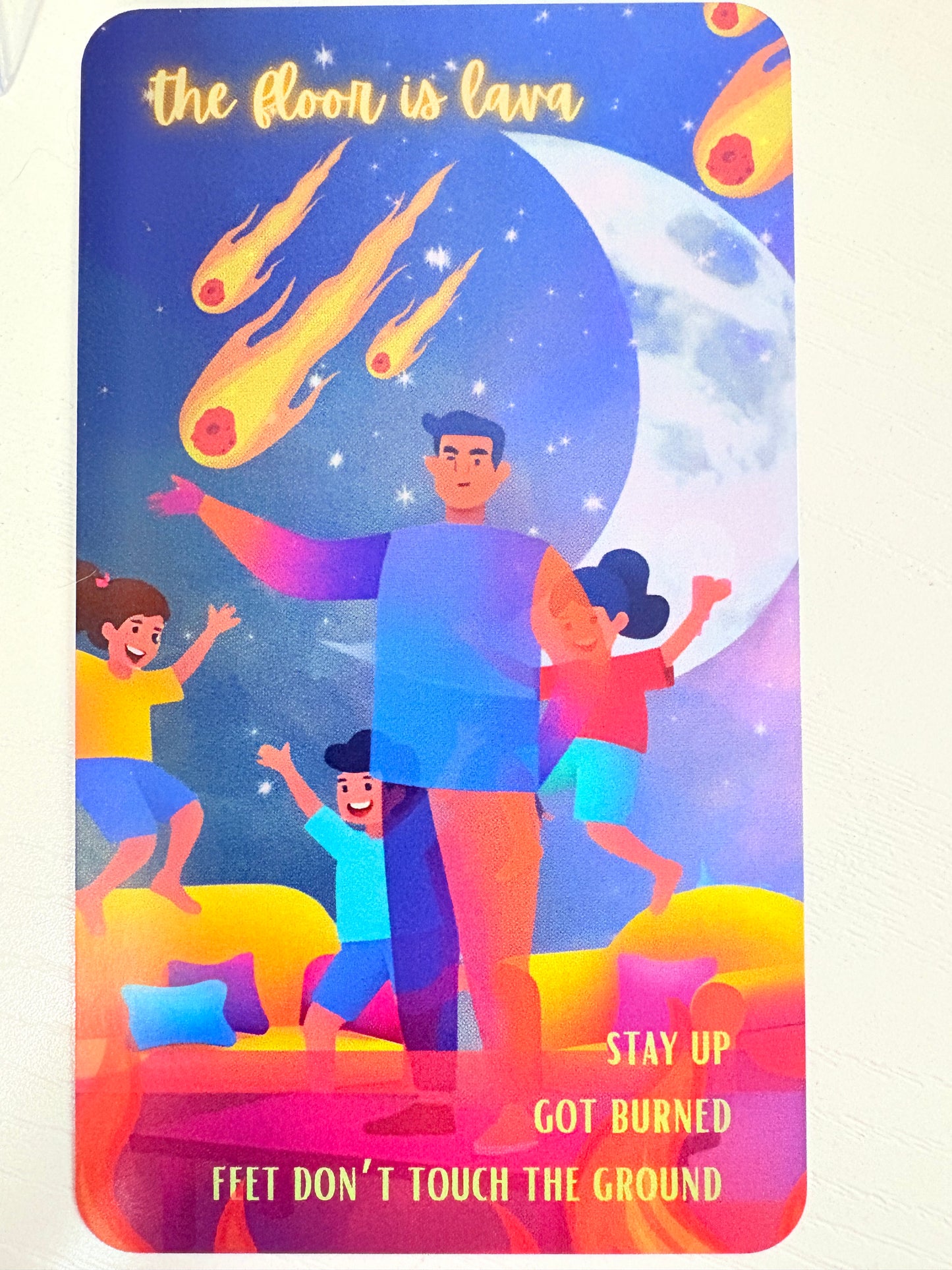 Colorful illustration of people and celestial elements on a rectangular card.
