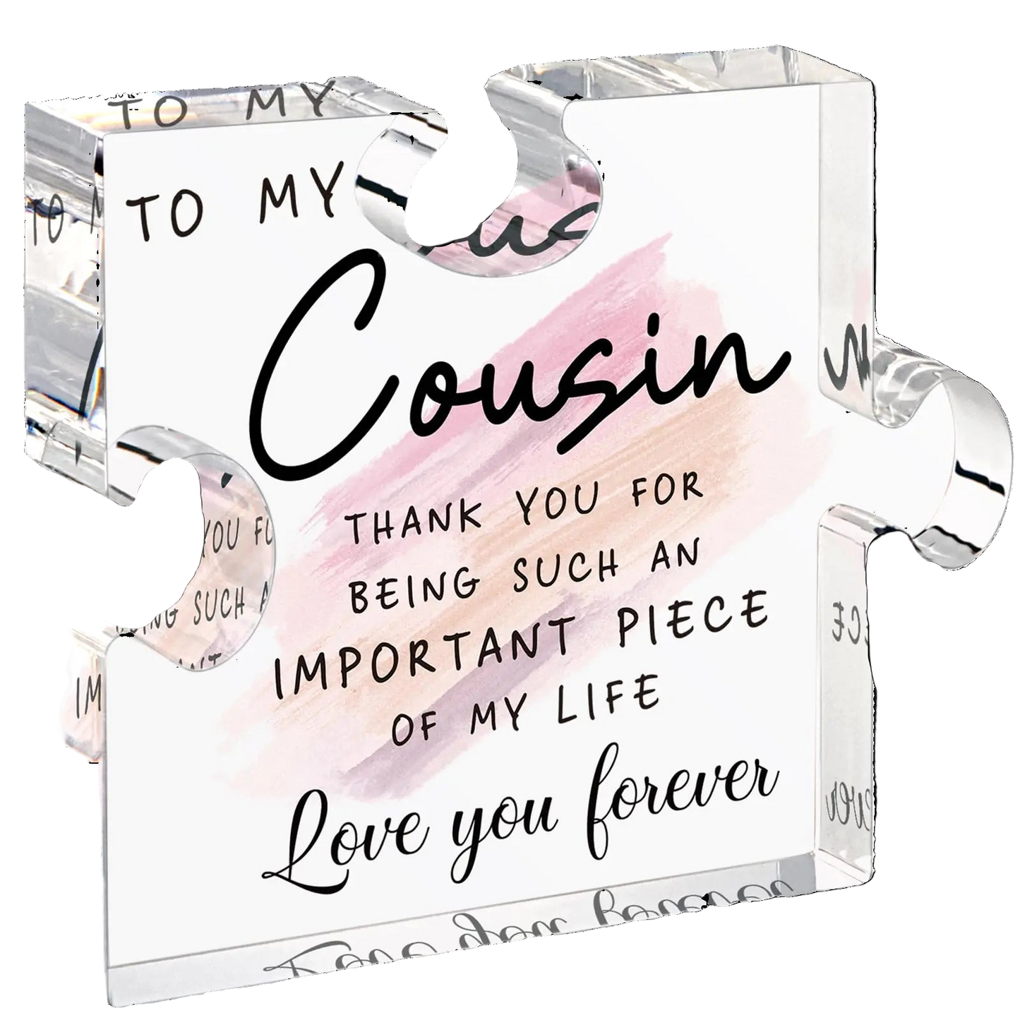 Clear glass block with engraved message to a cousin on a white background